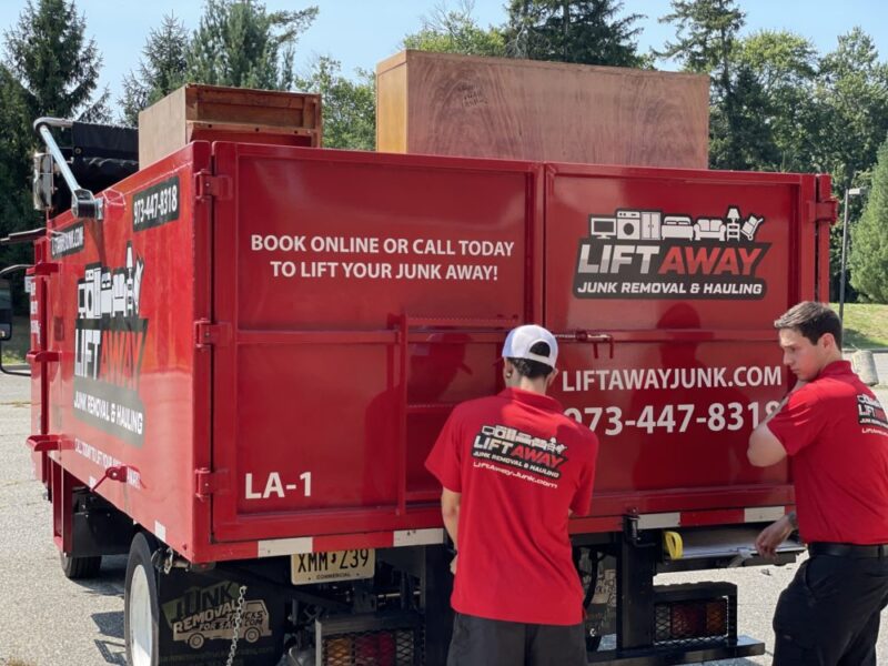 lift away junk removal crew in front of junk removal truck