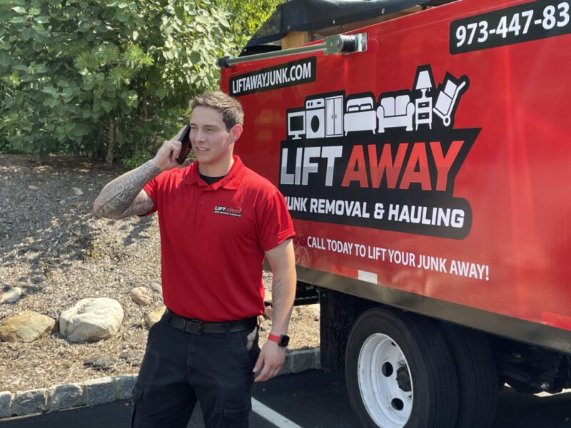 A Lift Away Junk removal & Hauling expert assisting a customer over the phone